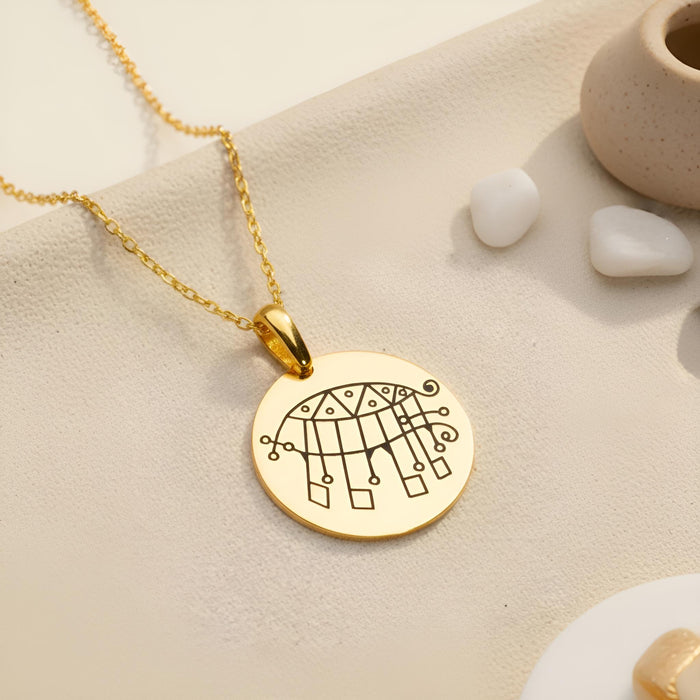 Gold Plated Silver Bifrons Sigil Necklace round pendant on textured neutral fabric