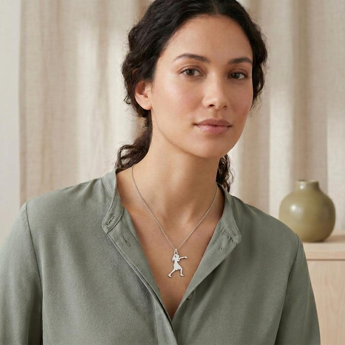 Boxing Woman Necklace worn on a model in a muted green collared blouse