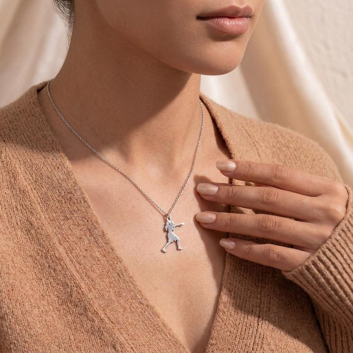 Boxing Woman Necklace worn on a model in a tan knit cardigan