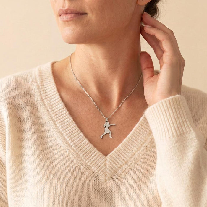 Boxing Woman Necklace worn on a model with a cream V-neck sweater