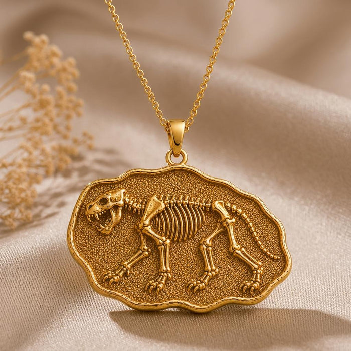 Gold Plated Silver Cave Lion Fossil Pendant with raised cave lion skeleton relief on champagne satin