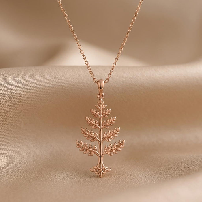 Rose Gold Plated Cedar Crest Necklace with tiered branch pendant on beige satin