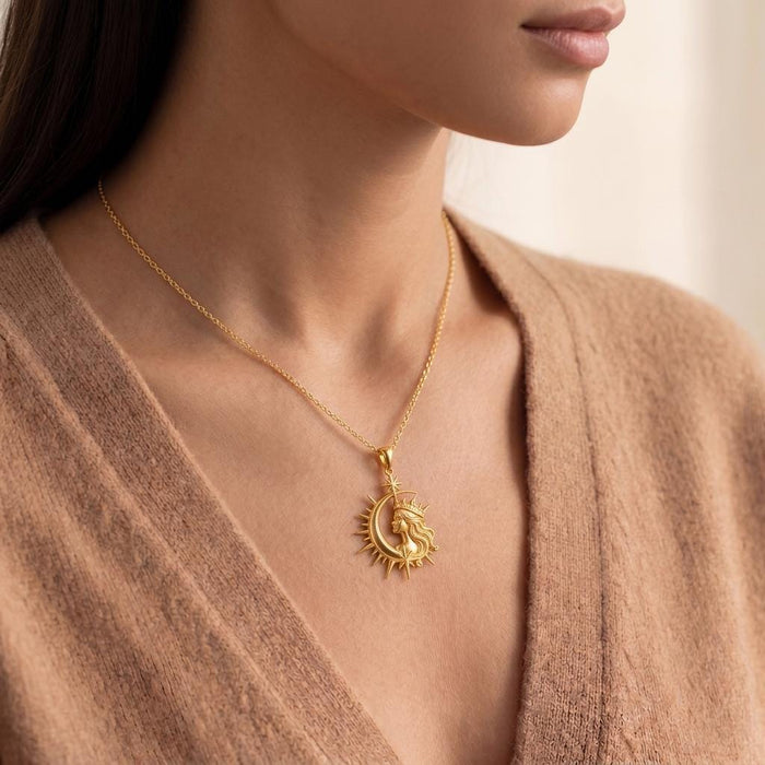 Side neckline view of a model wearing a Gold Plated Silver Cosmic Queen Necklace with celestial crowned profile pendant