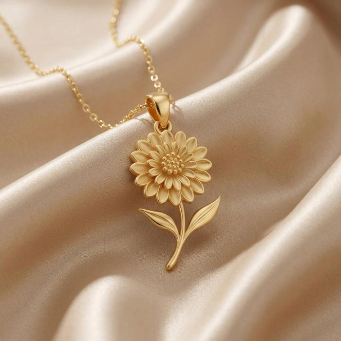 Gold Plated Silver Dahlia Flower Necklace with layered petals and two leaves on champagne satin