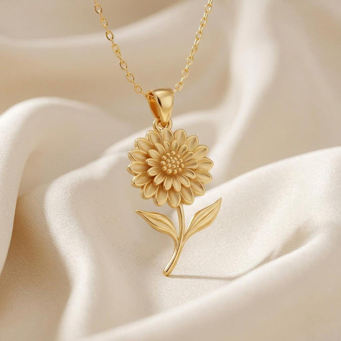 Close view of Gold Plated Silver Dahlia Flower Necklace with layered petals on ivory satin