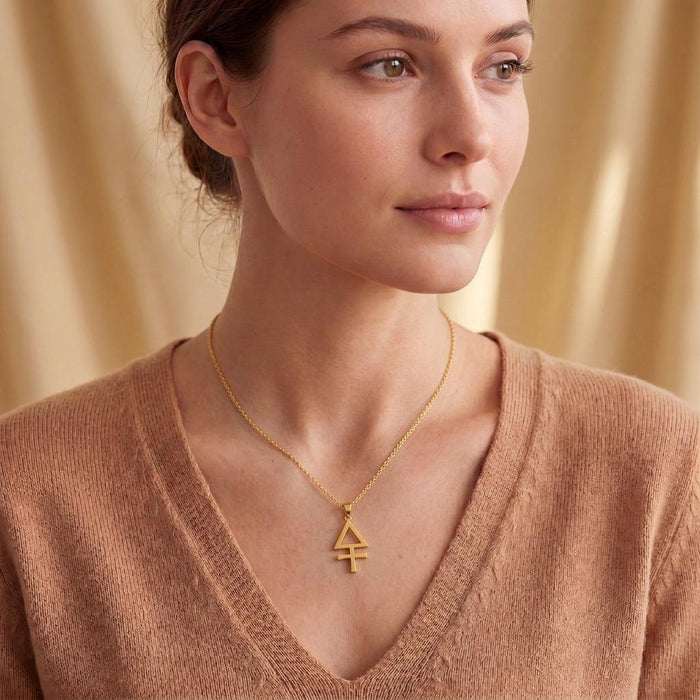 Gold Plated Silver Esoteric Sulfur Necklace worn at the neckline with a V-neck sweater