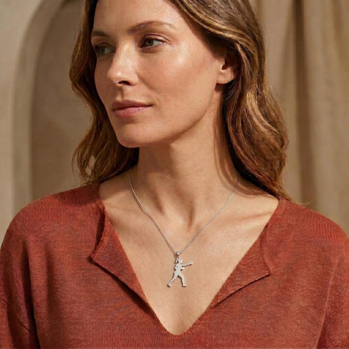Female Boxer Necklace worn with a rust-colored V-neck top