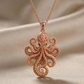Rose Gold Plated Fossil Octopus Pendant front view with circular tentacle details on pale satin