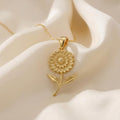 Gold Plated Silver Marigold Flower Necklace with layered petals and leaf details on ivory satin