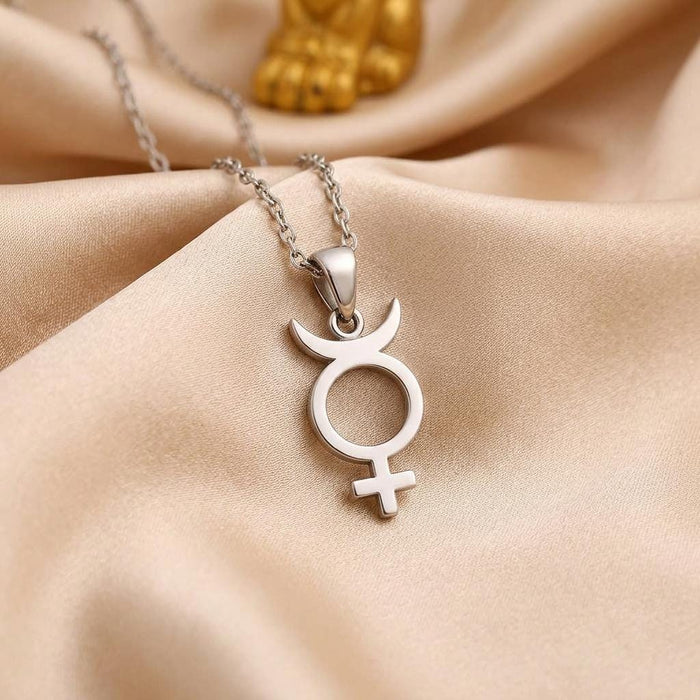 Mercury symbol pendant on champagne satin fabric