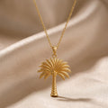 Gold Plated Silver Palm Crown Necklace with textured palm tree pendant on champagne satin