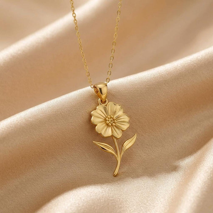 Gold Plated Silver Petunia Flower Necklace with dimensional petals and a raised dotted center on champagne satin