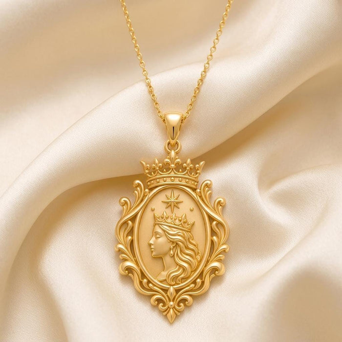 Front view of the Queen Aura Pendant with crowned portrait, star detail, and scrolling oval frame on ivory satin
