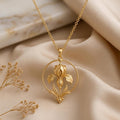 Gold Plated Silver Queen Iris Halo Necklace with a sculpted iris inside an open circular halo on champagne satin