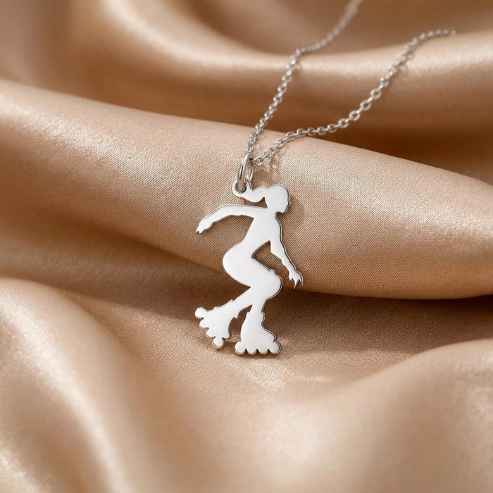 Close view of the polished Roller Skater Necklace pendant on champagne satin