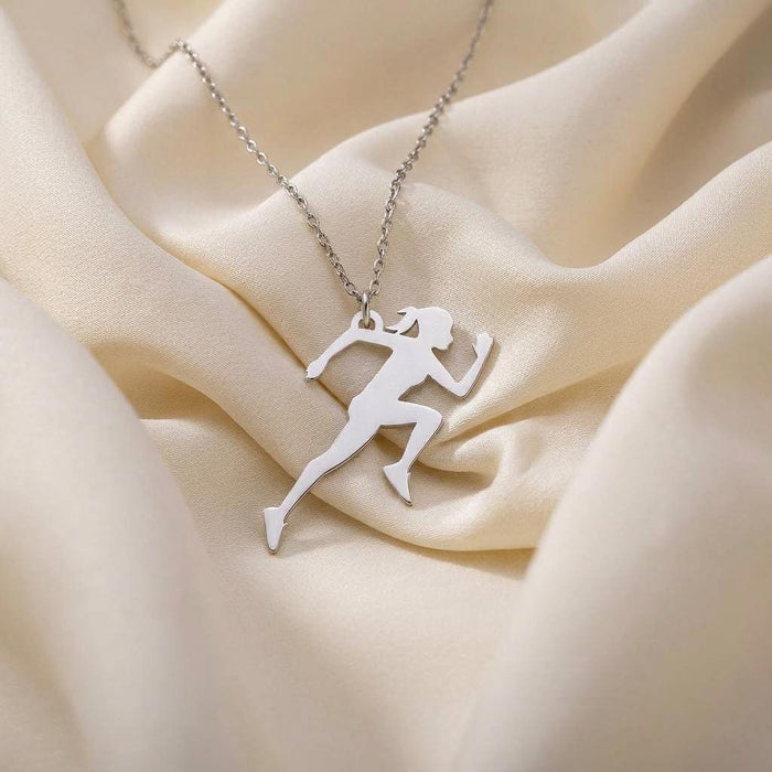 Running woman silhouette pendant necklace on ivory satin fabric