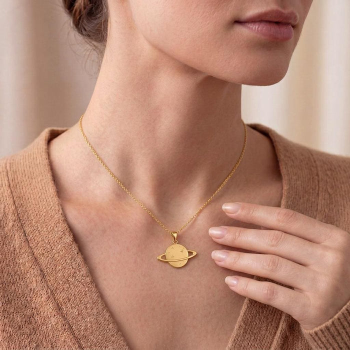 Gold Plated Silver Saturn Ring Necklace worn at the collarbone with a tan knit top