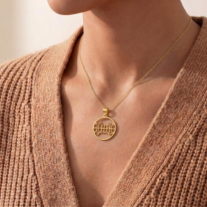 Gold Plated Silver Seal of Sallos Necklace worn with a textured tan cardigan