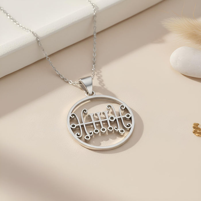 Silver Seal of Sallos Necklace with circular openwork pendant on a neutral surface