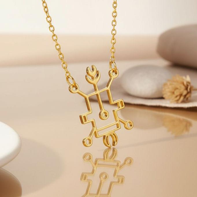 Gold Plated Silver Seal of Vassago pendant necklace above a reflective neutral surface
