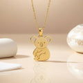 Gold Plated Silver Koala Necklace with seated koala pendant on a neutral display surface