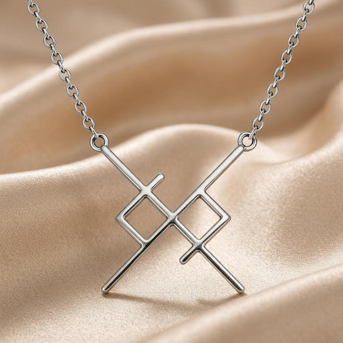 Silver Soul Bond Rune Necklace displayed on champagne satin