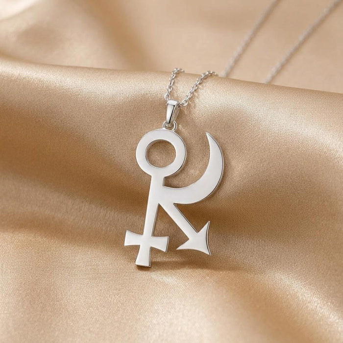 Close-up Sphinx Symbol Necklace pendant on champagne satin