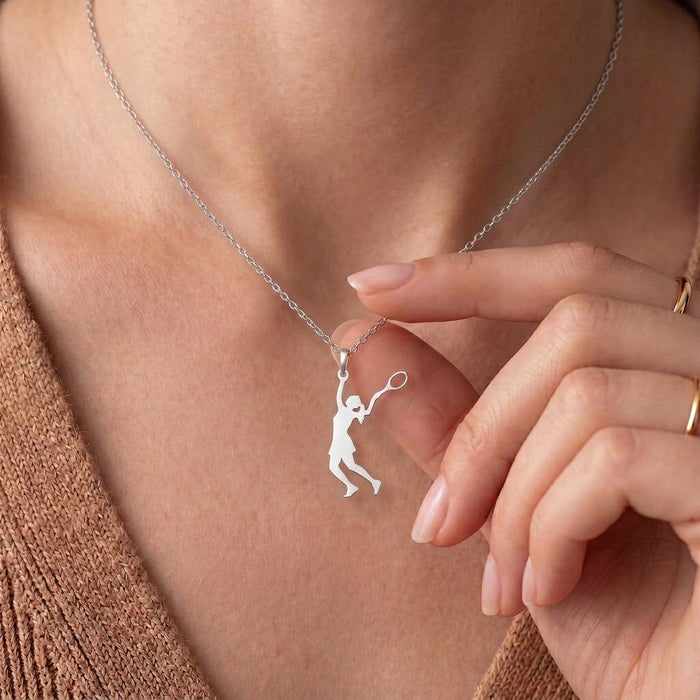 Close view of Tennis Player Necklace pendant with raised racket at the neckline