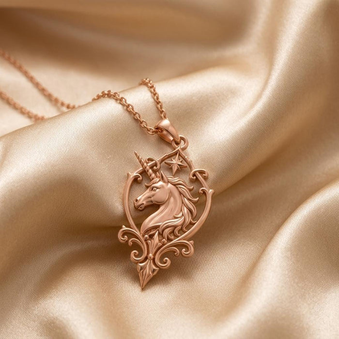 Rose Gold Plated Unicorn Sigil Necklace with a unicorn head, star detail, and pointed scrollwork pendant on champagne satin