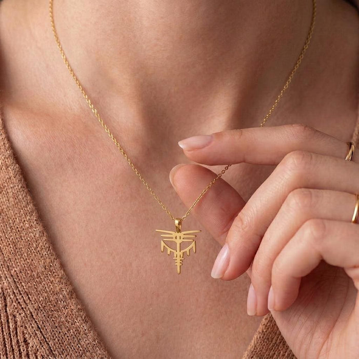 Close-up of the Gold Plated Silver Valkyrie Dragon Pendant worn at the neckline