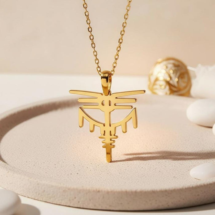 Gold Plated Silver Valkyrie Dragon Pendant necklace displayed on a round neutral tray