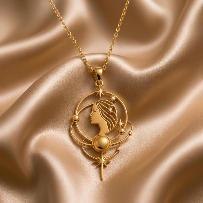 Gold Plated Silver Venus Aura Necklace with celestial profile, orbit arcs, stars, and lower star drop on champagne satin