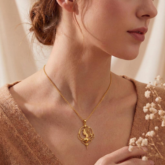 Gold Plated Silver Venus Aura Necklace worn at the collarbone with a knit top and dried flowers
