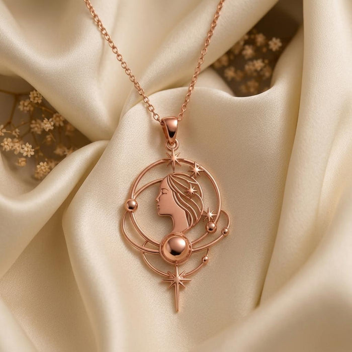 Rose Gold Plated Venus Aura Necklace with celestial profile, orbit arcs, and star drop on ivory satin