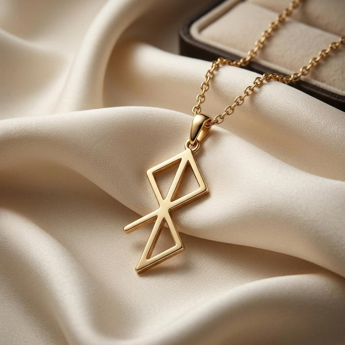 Gold Plated Silver Inner Peace Rune Necklace close-up on cream satin showing the central vertical bar and diagonal crossing bar
