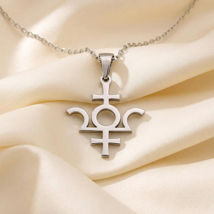 Silver Isis Symbol Necklace pendant with circular center on cream satin fabric