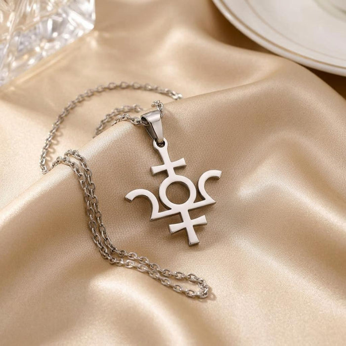 Silver Isis Symbol Necklace pendant and chain arranged on champagne satin