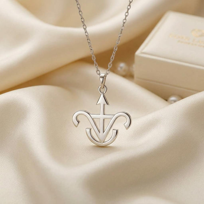 Jason Astrology Pendant in 925 sterling silver displayed on ivory satin beside a jewelry box
