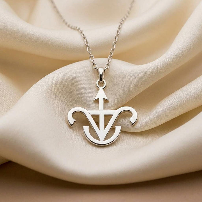 Jason Astrology Pendant with pointed upper detail and curved lower arms on ivory satin