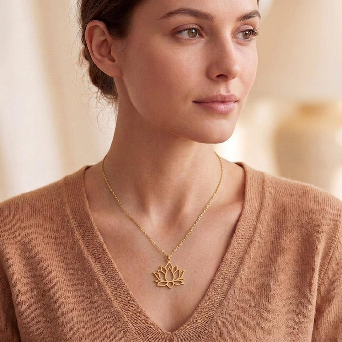 Gold Plated Silver Lotus Flower Necklace worn by a model in an indoor portrait