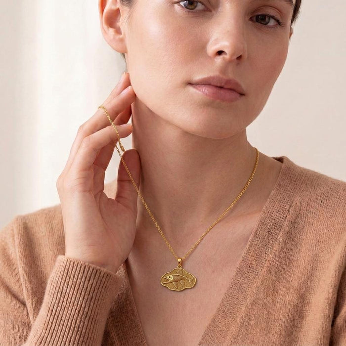 Model wearing a Gold Plated Silver Leedsichthys Fossil Pendant Necklace with a fossil fish plaque pendant