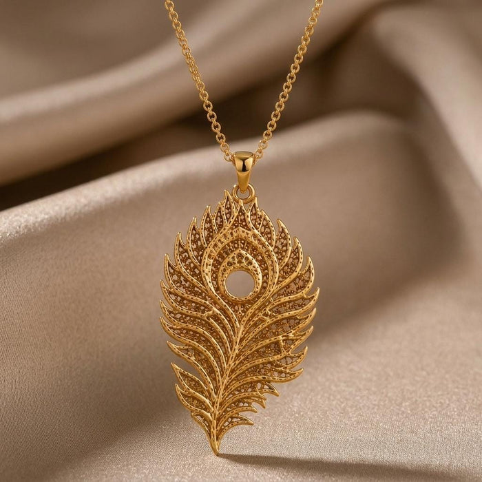 Gold Plated Silver Lunar Peacock Relic pendant necklace with an openwork peacock-feather design on champagne satin