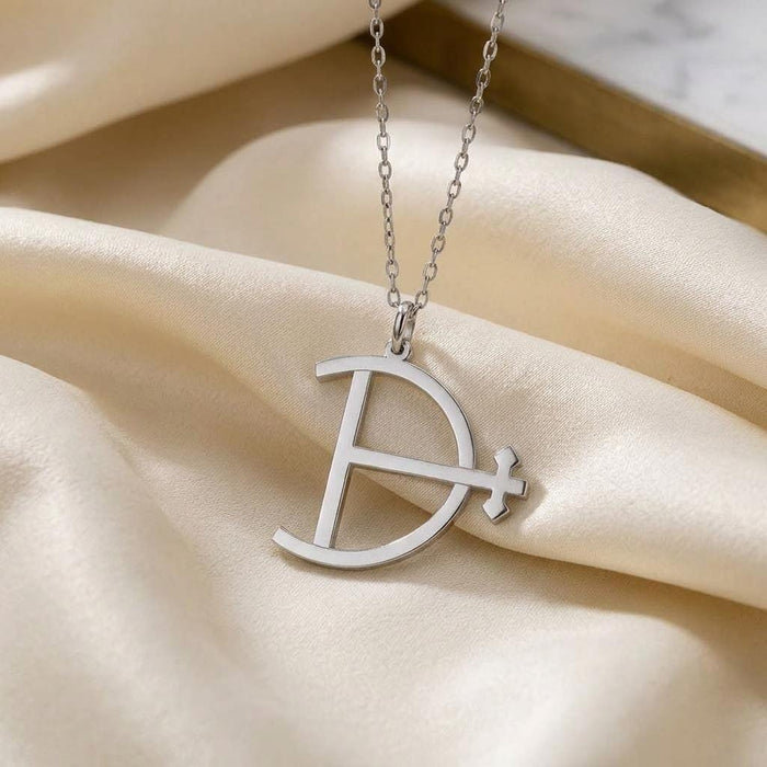 Close view of the Magnesium Symbol Necklace on ivory satin