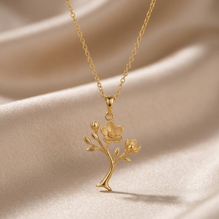 Gold-finish Magnolia Soft Bloom Pendant with branching flower and buds on champagne satin