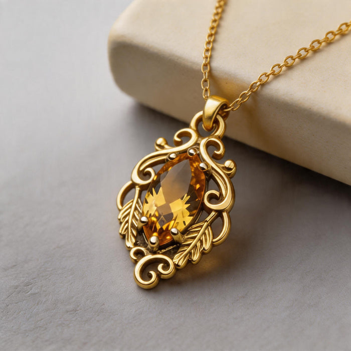 Gold Plated Silver Marquise Yellow Topaz Necklace with a yellow marquise-shaped center stone beside a cream display block