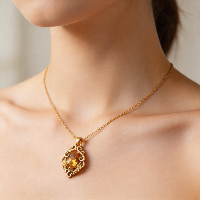 Gold Plated Silver Marquise Yellow Topaz Necklace worn at the collarbone with the ornate marquise pendant visible