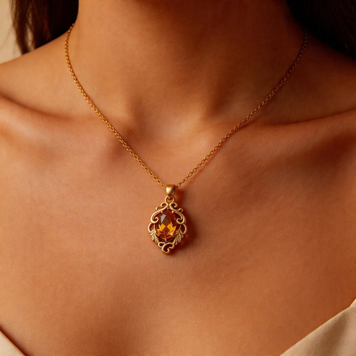 Gold Plated Silver Marquise Yellow Topaz Necklace worn with an open neckline, showing the vertical scrollwork pendant