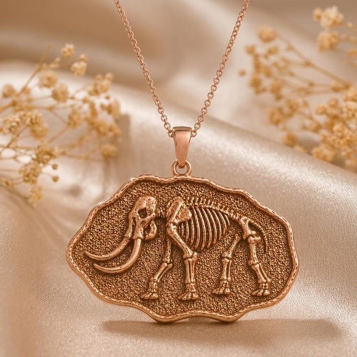 Rose Gold Plated Mastodon Fossil Pendant Necklace with raised skeleton relief and dried floral styling