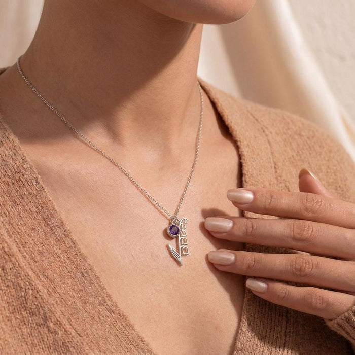 Close view of a Silver May Birth Flower Necklace with bell-shaped blooms resting at the collarbone