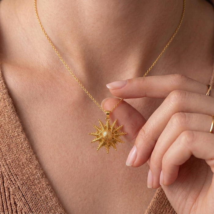 Close view of the Gold Plated Silver Mintaka Star Pendant Necklace worn at the neckline